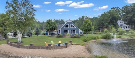 Island Cove View from the boat w/ sandy beach, fountain, tiki bar, & patio