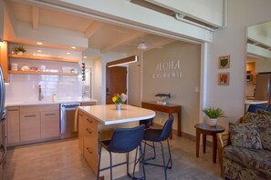 The kitchen island provides lots of space for prepping, socializing, & eating!