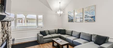 The Living room with large sofa and new TV set