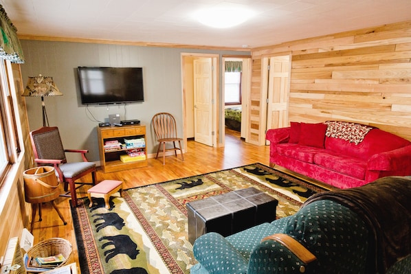 Beautiful living room complete with games and a TV.