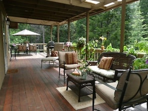 Middle tier featuring cozy large wrap around deck!