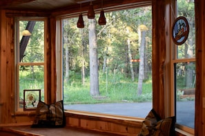 While enjoying the comforts of the cabin you have a beautiful view of the forest