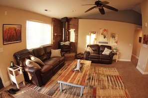 Comfortable living room with lazy boy leather reclining sofas. 