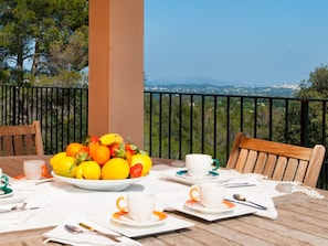 Outdoor dining table in the courtyard  with  mountain views.