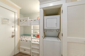 Cozy bunks next to a washer and dryer provided.