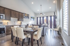 Dining Area - Wooden table with seating for six guests.