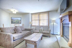 Living Area - Two arm chairs and a sofa.