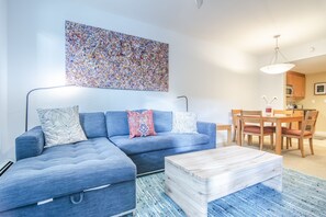 Living Area - Queen size sofa sleeper. Bedding stored in chaise lounge.