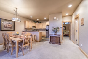 Dining Area - Large table with seating for eight guests. Plus additional seating at the kitchen island.