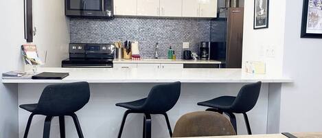 Updated kitchen, bright and modern, ready to host your stay!