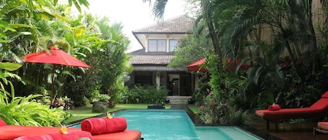 Pool, wooden deck & deck chairs