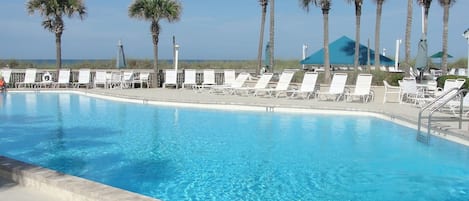 Three pools and pool decks. TWO located right between your condo & the beach.