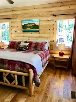 main floor bedroom with king size bed and 40"TV