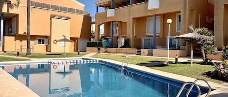 Modern apartment right by the pool....