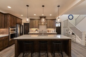 Large modern kitchen fully equipped for entertaining large groups