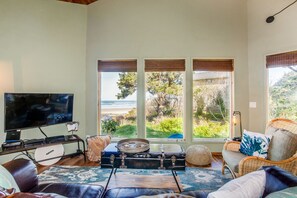 Living area with views of Starr Creek and the ocean.