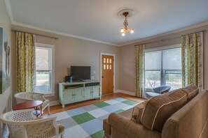 family room with flat screen TV and queen sleeper sofa