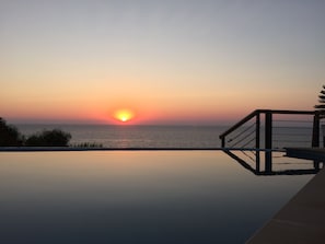 sunset by the pool