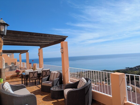 Private terrace including sofa, armchairs, dining table & chairs and 4 sunbeds. 