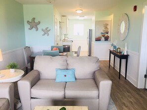 Living Room view into the dining area and kitchen.