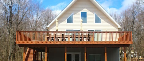 Patio with weber grill, hot tub second floor deck with patio table