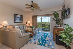 Beautiful spacious living room with flat screen TV.