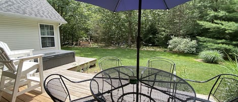 Large deck that overlooks fenced in yard, hot tub and fire pit.  Very private!