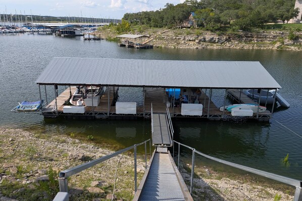 Lake levels are up! Boat dock with ready boat access, paddle board or swimming. Picture as of July 2025.
