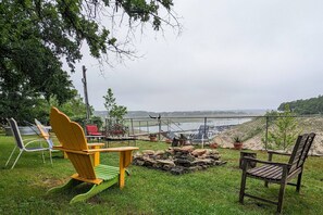 Gather by the fire pit with lake views