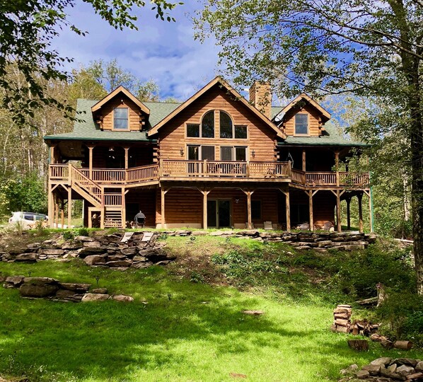 Back yard, wrap around deck, patio & private lawn with string lights & firepit