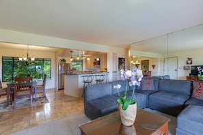The kitchen, living, and dining rooms are all open to each other, which lets conversation flow as easily as the ocean breezes