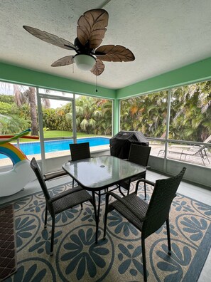 Screened in patio with weber grille and seats six.