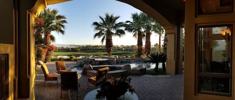 Pool area with 7th fairway, lake and in far distance, the Indio Mountains