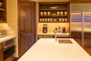 The large kitchen is loaded with top appliances for elegant cooking and catering