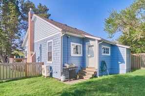 Out back, a huge yard awaits — perfect for BBQs, games, and family fun