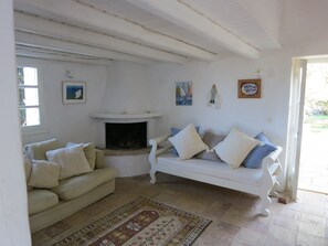 Sitting room and French windows to the rear garden and pool