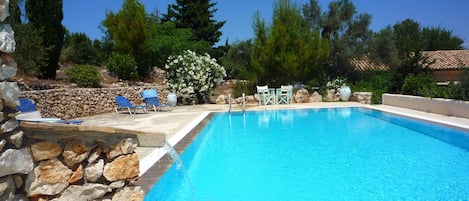 pool with villa  behind , one acre garden of olives , pine ,oleander ,plumbago