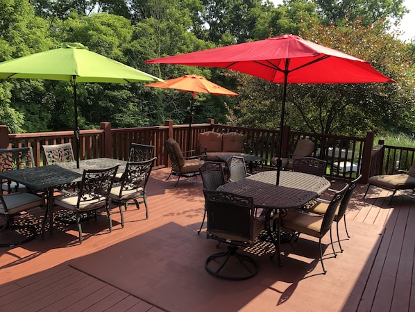 Large deck with two tables for 6 and casual seating