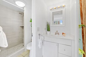 Full bathroom with walk-in shower.