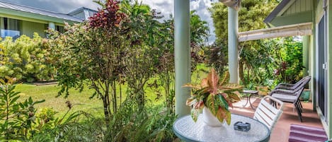 The large ground floor lanai is the perfect spot for enjoying a quiet morning, taking in the beautiful grounds, and sipping a cup of coffee.
