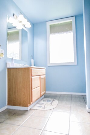 View of large bathroom from hallway door