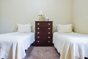 Picture of 1st bedroom with 2 twins. 2nd twin similar room across the hall.