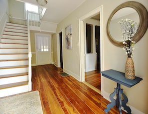 Entry way  - with stairs leading to the second floor, bathroom, and bedrooms.