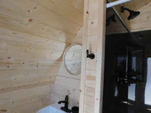 Private bath pod, located next to your sleeping pod,  one key for both