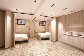 Bedrooms with retractable partitions.