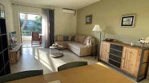 Large and modern, warm and cozy living room with garden view