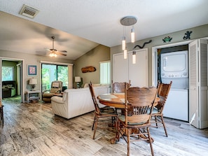 View of the living and dining area at this New Smyrna Beach vacation rental.