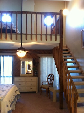 Open loft over the king bed. 2 twin beds + porthole windows