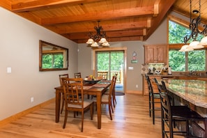 Open dining space and natural granite breakfast bar