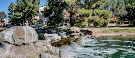 Enjoy the community waterfall as you stroll around the lake